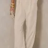 MACACÃO DUBAI PANTALONA DETALHES MARTINGALE - BEGE